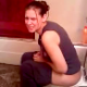 An attractive girl grunts & strains while sitting on a toilet trying to take a shit. It does not seem like she has much luck.